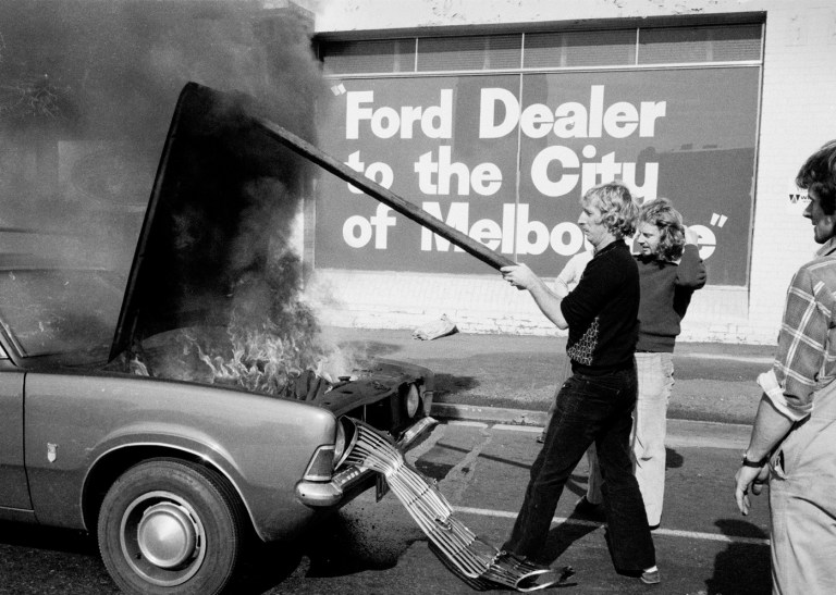 A Ford Cortina on fire outside ‘Morley Ford’ South Melbourne 1983 Andrew Chapman
